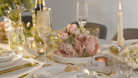 Close-Up-Of-Table-Set-For-Meal-At-Wedding-Reception-With-Place-Cards-For-Bride-And-Groom-2